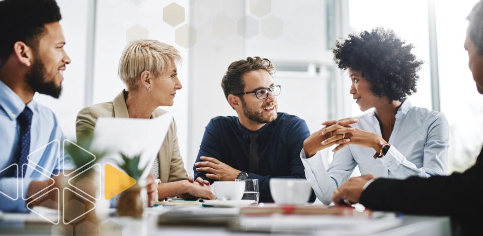 Employees meeting around table to discuss workplace values