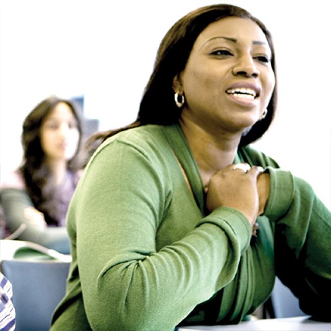 Female adult learner speaking in the classroom