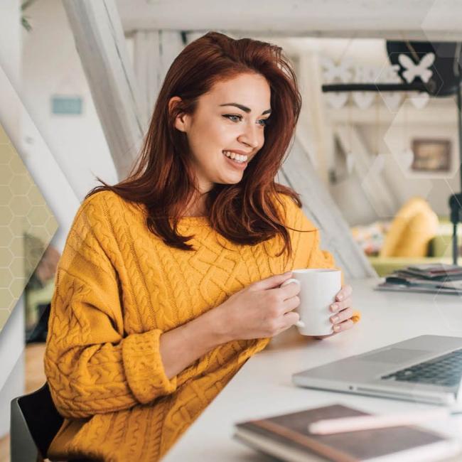 Working professional supporting her mental wellbeing by taking a break from working from home to drink coffee with her cat.